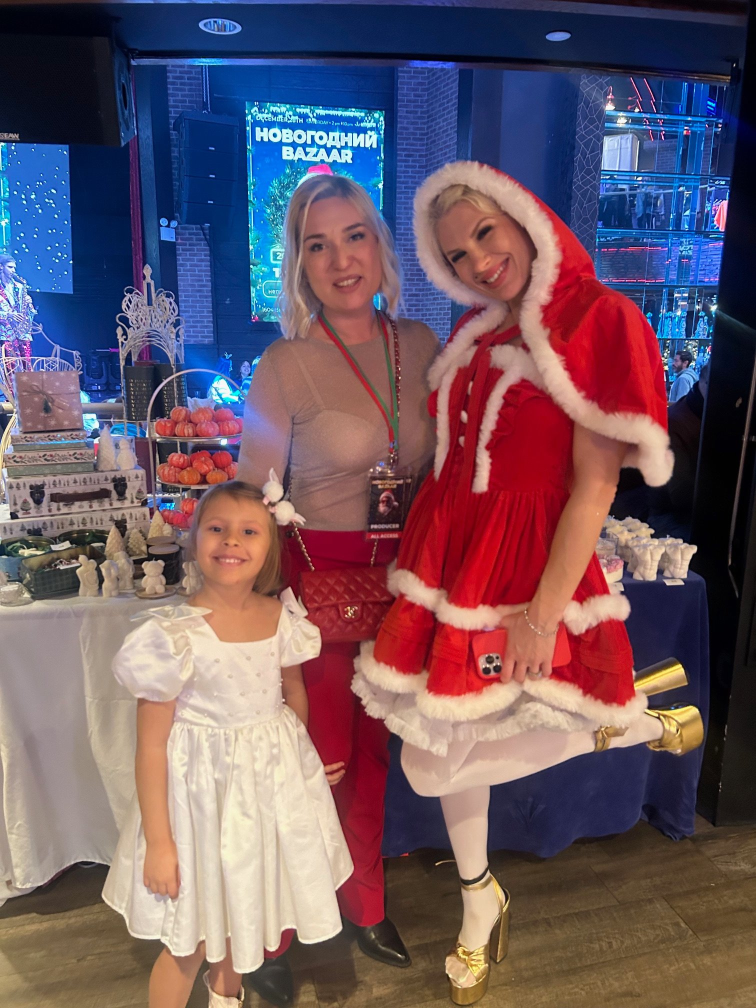 Guests with Snegurochka (Snow Maiden) at the holiday market