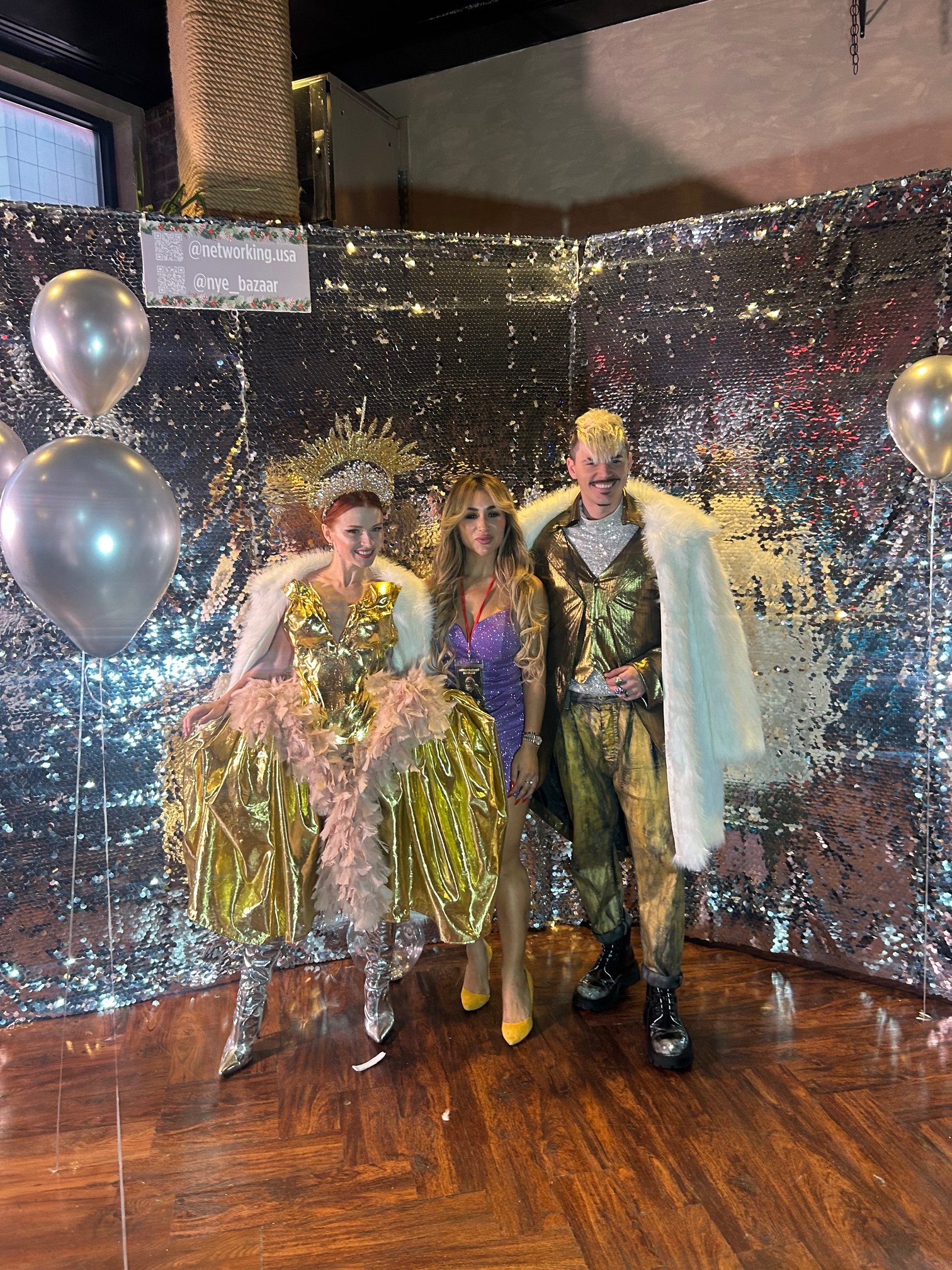 Guests with performers at the photo booth