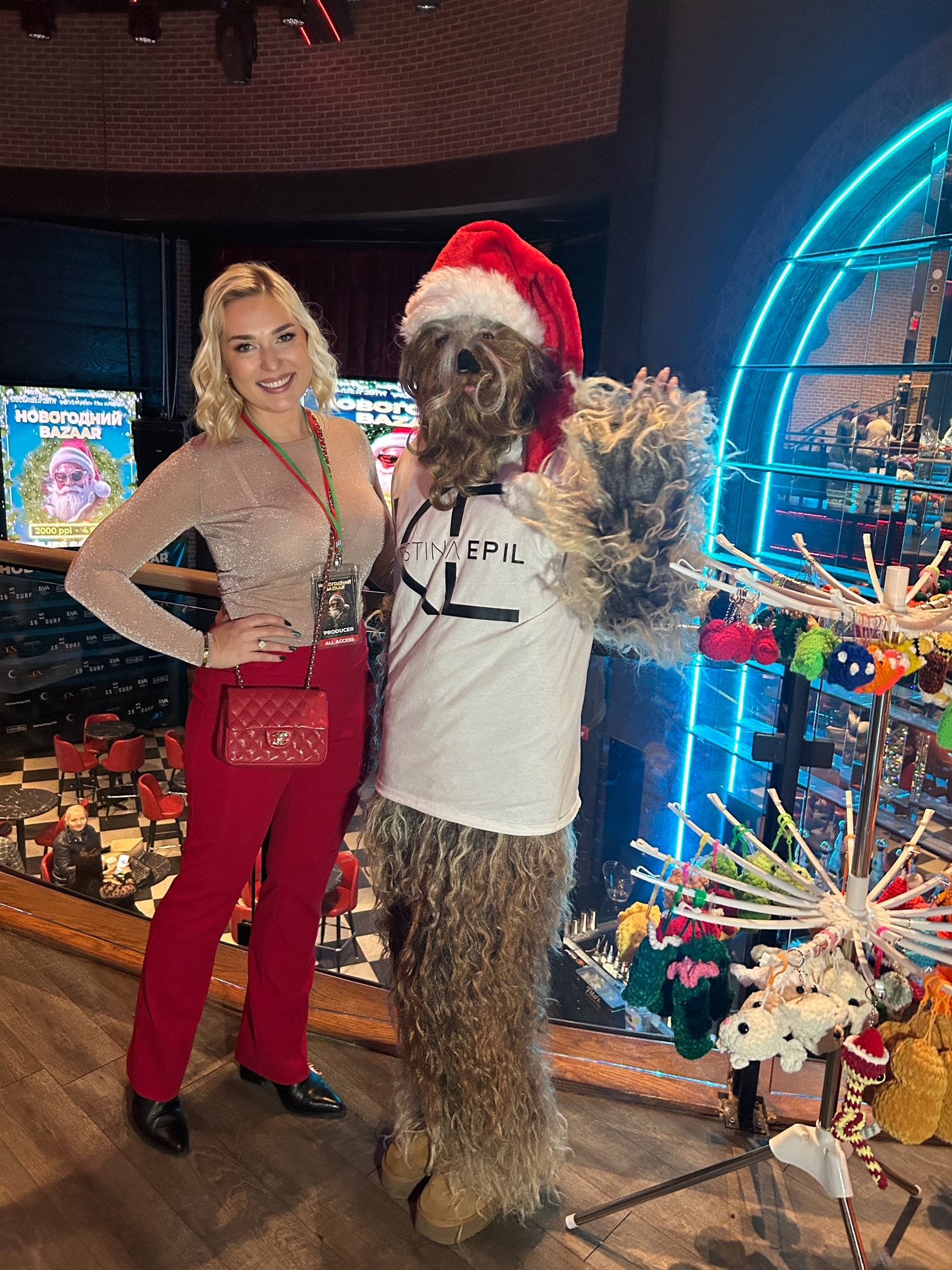 Olesya Smith with a festive character at the holiday market