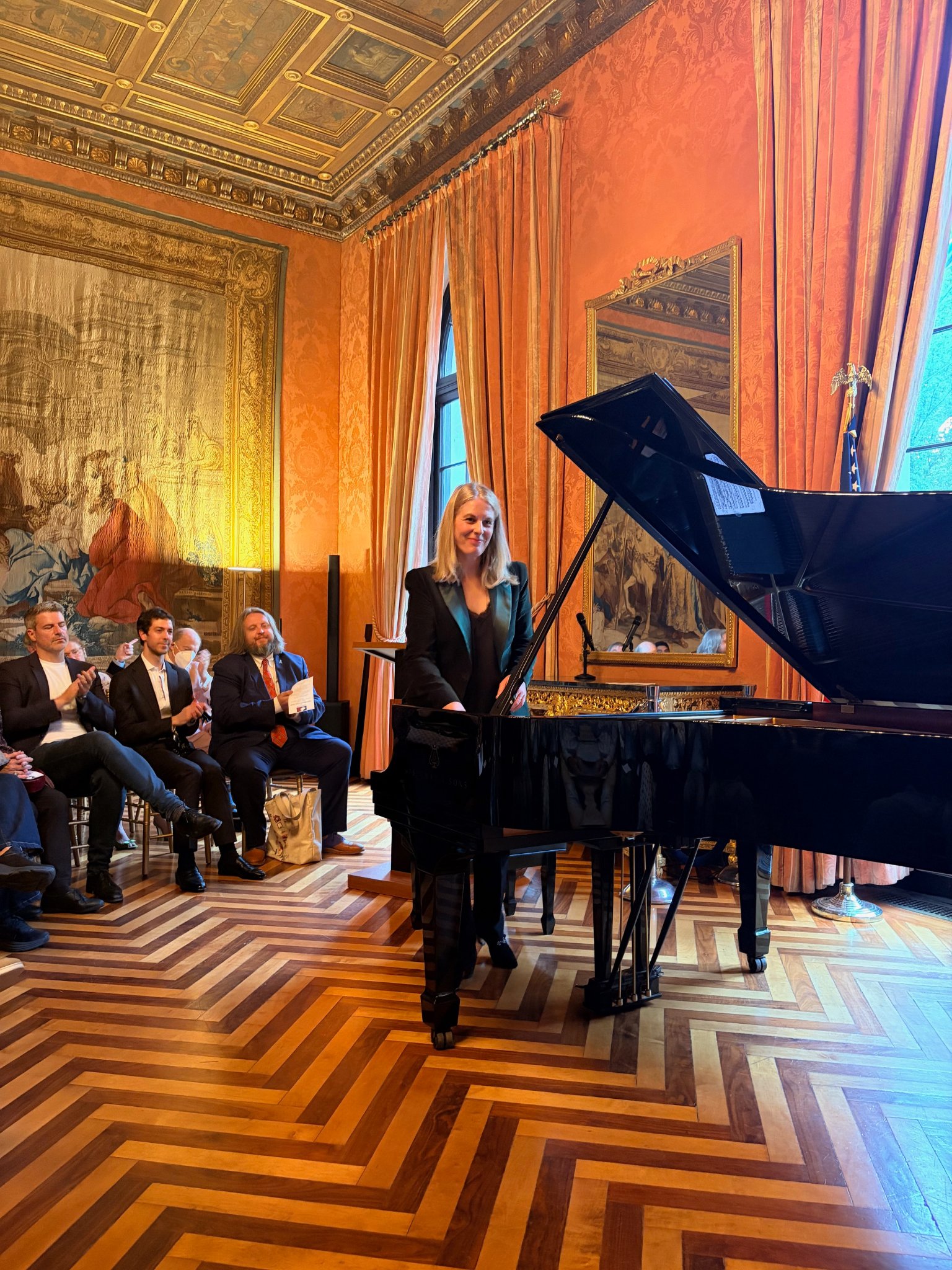 Pianist Claire-Marie Le Guay taking a bow at the French Embassy