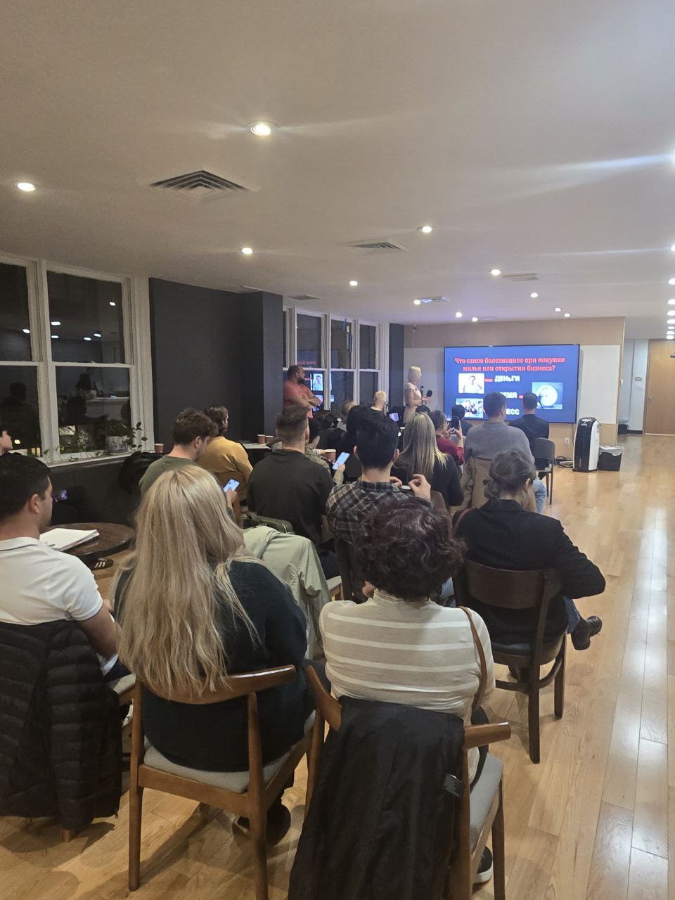 Olesya Smith presenting to a packed audience in Manhattan